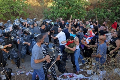 Lebanese Armenians clash with security forces during a demonstration outside the Azerbaijani embassy in Ain Aar on Thursday, denouncing Azerbaijan's reintegration of Nagorno-Karabakh.