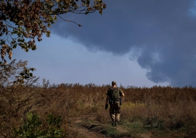 A Ukrainian serviceman walks at a position near the front line in the Donetsk region, Ukraine, on Tuesday.