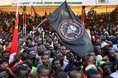 Supporters of Niger's National Council of Safeguard of the Homeland wave a flag of the private Wagner military company during a protest near the capital Niamey on Sept. 16.