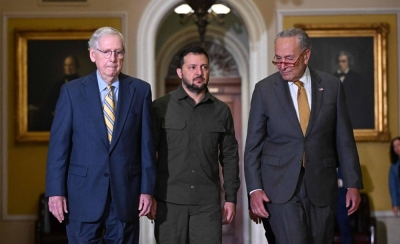 Ukrainian President Volodymyr Zelenskyy is accompanied by U.S. Senate Majority Leader Chuck Schumer and Senate Minority Leader Mitch McConnell in the Old Senate Chamber, at the U.S. Capitol in Washington on Sept. 21.