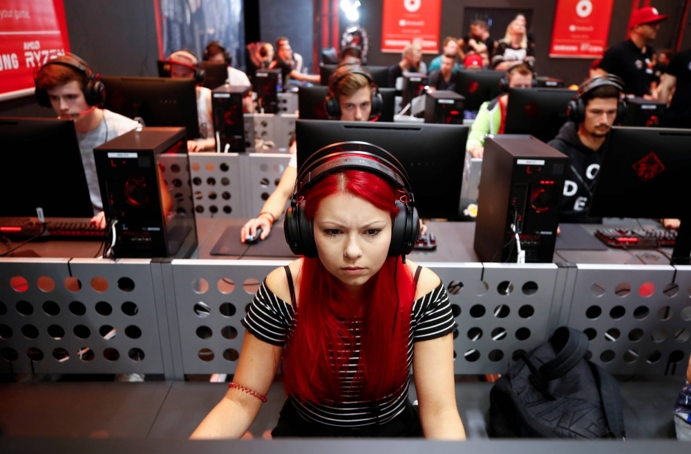 Gamers play during the first day of Europe's leading digital games fair, Gamescom, in Cologne, Germany, in August 2019