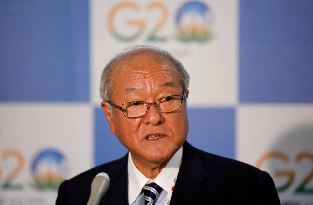 Finance Minister Shunichi Suzuki says higher interest rates would worsen the country's finances.