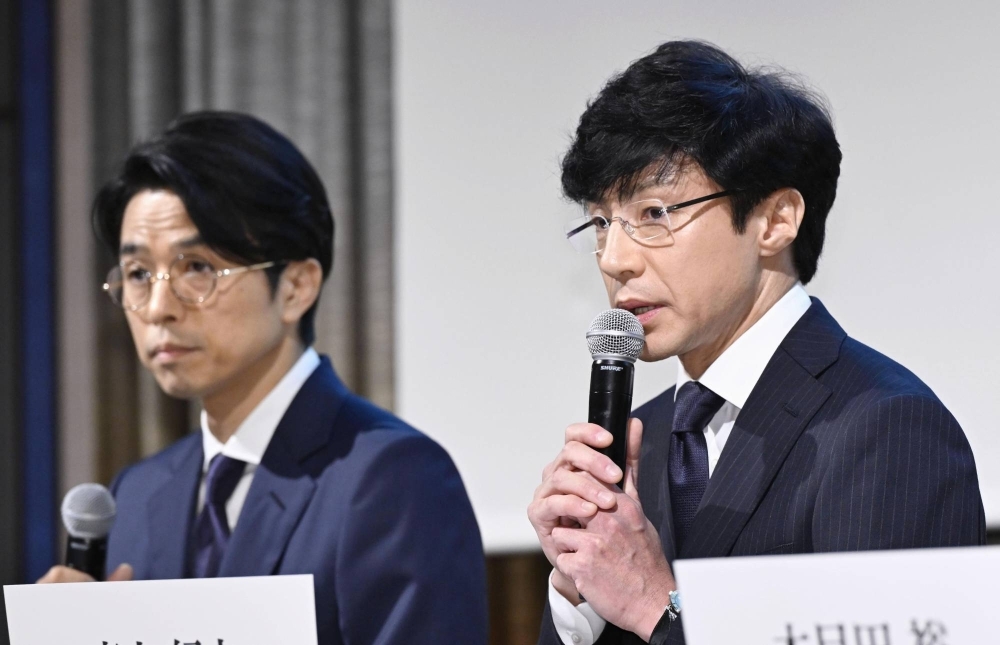 Noriyuki Higashiyama (right) and Yoshihiko Inohara attend a news conference in Tokyo on Monday.