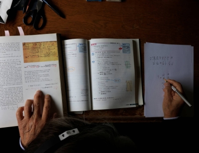 A 93-year-old at his office in Tokyo solves ancient math problems in Egyptian numbers to keep his mind sharp.