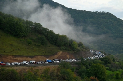 Vehicles carrying refugees from Nagorno-Karabakh, a region inhabited by ethnic Armenians, pack the road leading towards the Armenian border on Sept. 25. 