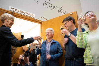 French-Swedish physicist Anne L'Huillier, one of this year's Nobel laureates in physics, celebrates with students and colleagues in Lund, Sweden, on Tuesday.