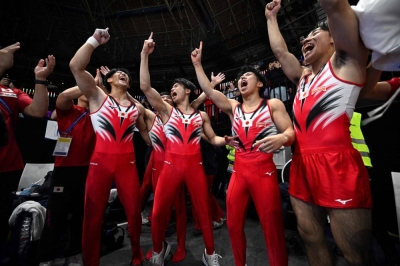 Japan's gymnasts celebrate after winning the men's team final during the Artistic Gymnastics World Championships in Antwerp, Belgium, on Tuesday.