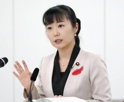 Ayuko Kato, minister in charge of child policies, speaks to reporters in Tokyo on Tuesday.