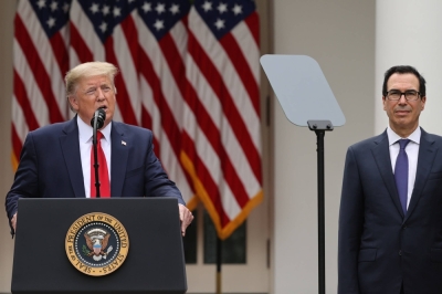 Then-U.S. President Donald Trump, accompanied by Treasury Secretary Steven Mnuchin, announces a slew of retaliatory measures against China, including sanctions, at a news conference at the White House in May 2020.