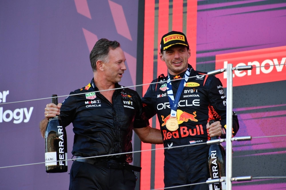 Max Verstappen (right) celebrates with Red Bull's team principal, Christian Horner, after the Dutch star won the Japanese Grand Prix on Sept. 24 to clinch the constructors' title for the team.