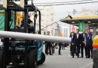 Prime Minister Fumio Kishida (front left) inspects a shipping company in Tokyo's Ota Ward in September. | Pool / via Kyodo