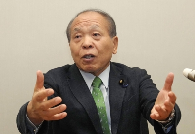 Nippon Ishin no Kai lawmaker Muneo Suzuki speaks during an interview.