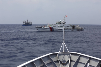 A China Coast Guard ship blocks the direction of a Philippine Coast Guard ship conducting a resupply mission for Filipino troops stationed at a grounded warship in the South China Sea on Wednesday.