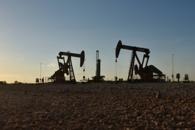 Pump jacks in an oil field in Midland, Texas. Big Oil is responsible for the bulk of human-induced greenhouse gas emissions and pressure for action is building.