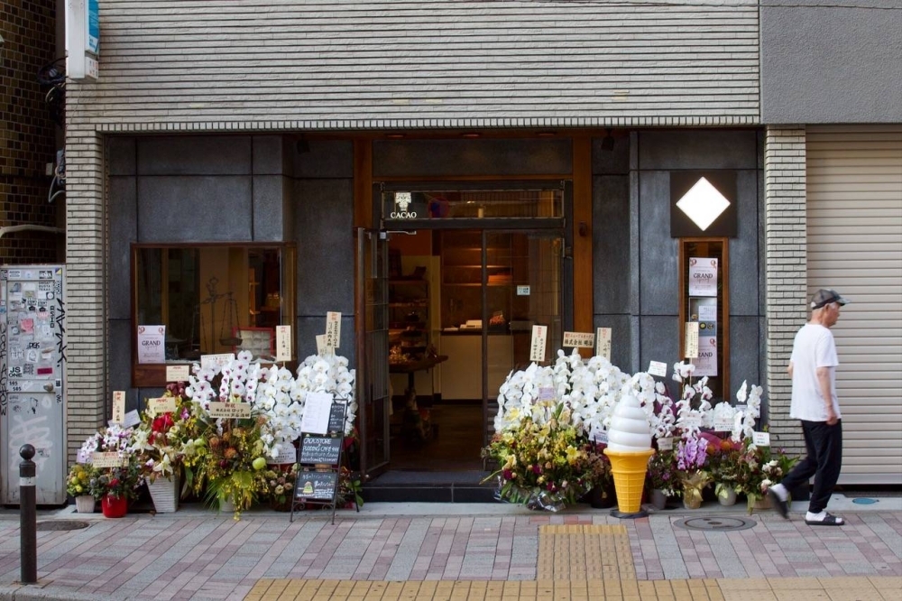 Orchids outside a shop in Tokyo during its grand opening. Orchids are common business gifts throughout Asia.