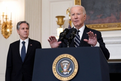 U.S. President Joe Biden speaks in the State Dining Room of the White House in Washington, on Saturday, as Secretary of State Antony Blinken listens.