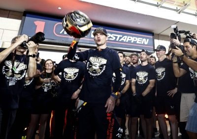 Red Bull's Max Verstappen (center) celebrates with his team after winning the Formula One driver's championship in Lusail, Qatar, on Saturday.