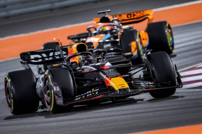 Red Bull's Max Verstappen drives ahead of McLaren's Oscar Piastri during the Qatar Grand Prix in Doha on Sunday.