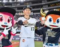 Orix pitcher Ryuhei Sotani (center) celebrates his first professional win, against the Hawks, at Kyocera Dome Osaka on Monday. | Kyodo