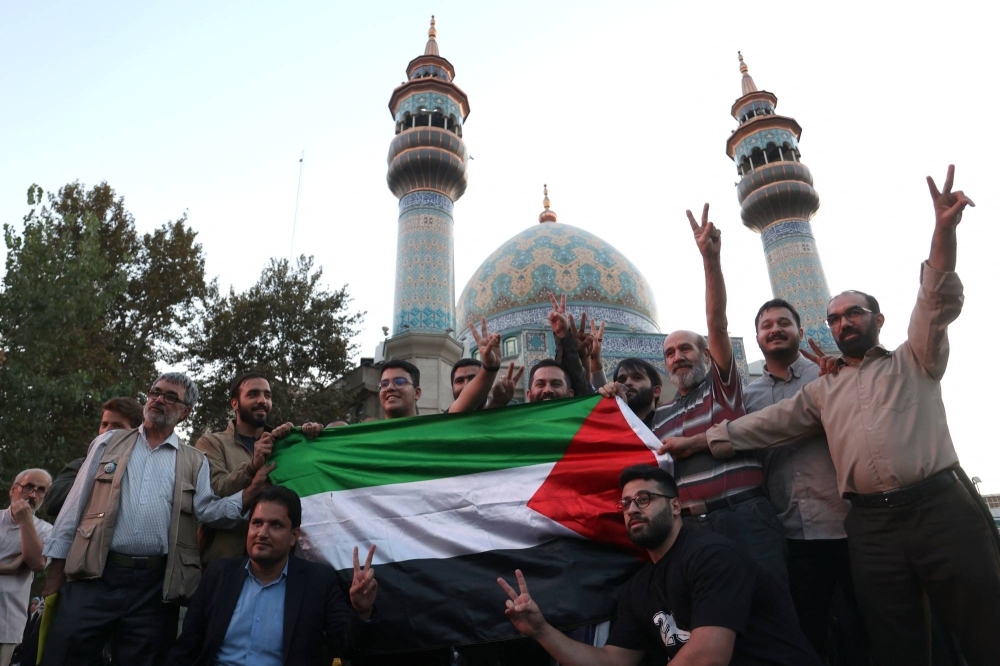 Iranians gather in Tehran on Saturday to show support for Palestinians after Hamas' attack on Israel.