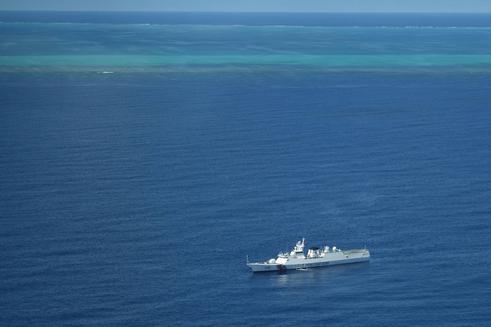 A Chinese coast guard ship patrols the area near the Scarborough Shoal in the disputed South China Sea on Sept. 28. 