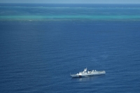 A Chinese coast guard ship patrols the area near the Scarborough Shoal in the disputed South China Sea on Sept. 28.  | AFP-JIJI