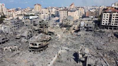 Houses and buildings destroyed by Israeli strikes in Gaza City, on Tuesday
