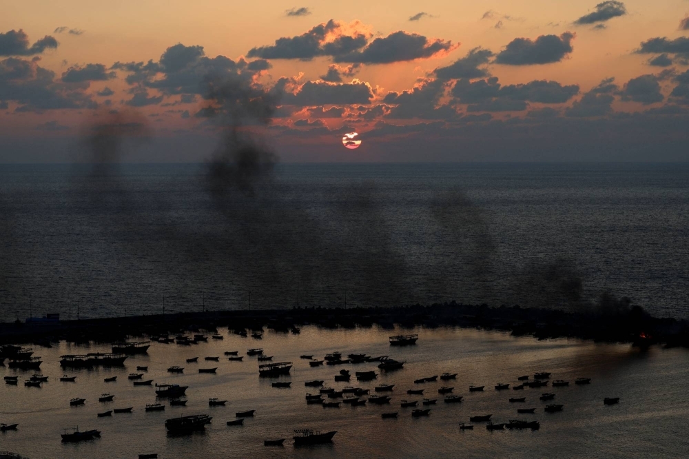 Smoke rises after Israeli strikes on the seaport of Gaza City on Tuesday.