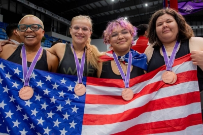 U.S. wrestlers (from left) Christina Griffin, Madison Guinn, Etan Perez and Kellyann Ball celebrate after winning bronze in the women's team competition at the Sumo World Championships in the western Tokyo city of Tachikawa on Sunday.