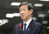 Environment Minister Shintaro Ito speaks to reporters at the ministry on Tuesday. | Kyodo