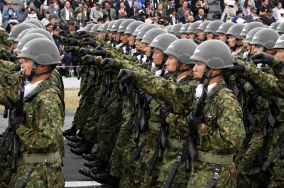 Ground Self-Defense Force members take part in a military review in Asaka, Saitama Prefecture, in October 2018.