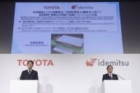Koji Sato (left), president of Toyota Motor, speaks while Shunichi Kito, president and CEO of Idemitsu Kosan, looks on during a joint news conference in Tokyo on Thursday. | Bloomberg