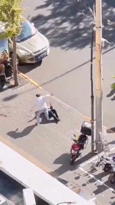 A screen grab obtained from a social media video shows the scene of the stabbing of an Israeli Embassy staff member, in Beijing on Friday.  