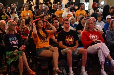 Supporters of the "Yes" vote listen to the results of the referendum on whether to officially recognize Australia's Indigenous peoples, at an event in Sydney on Saturday. 