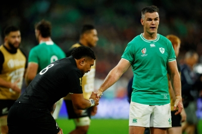 New Zealand's Ardie Savea (left) shakes hands with Ireland captain Johnny Sexton after their 2023 Rugby World Cup quarterfinal in Saint-Denis, France, on Saturday.