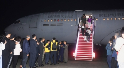 People evacuated from Israel arrive at Seoul Air Base in Seongnam, just south of the South Korean capital, late Saturday.