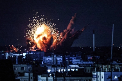 A ball of fire and smoke rises during an Israeli strike on the Gaza Strip on Monday. 