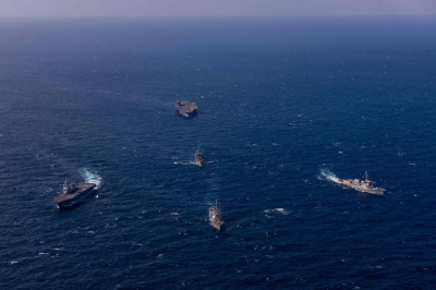 South Korea's Aegis-equipped destroyer Yulgok Yi I (right), the U.S. aircraft carrier USS Ronald Reagan (top), the Aegis-equipped USS Shoup destroyer (bottom center), the Maritime Self-Defense Force's Hyuga destroyer (left) and the South Korean Navy's Cheonji (center) sail in formation during a joint maritime drill in international waters southeast of South Korea's Jeju Island on Oct. 10.
