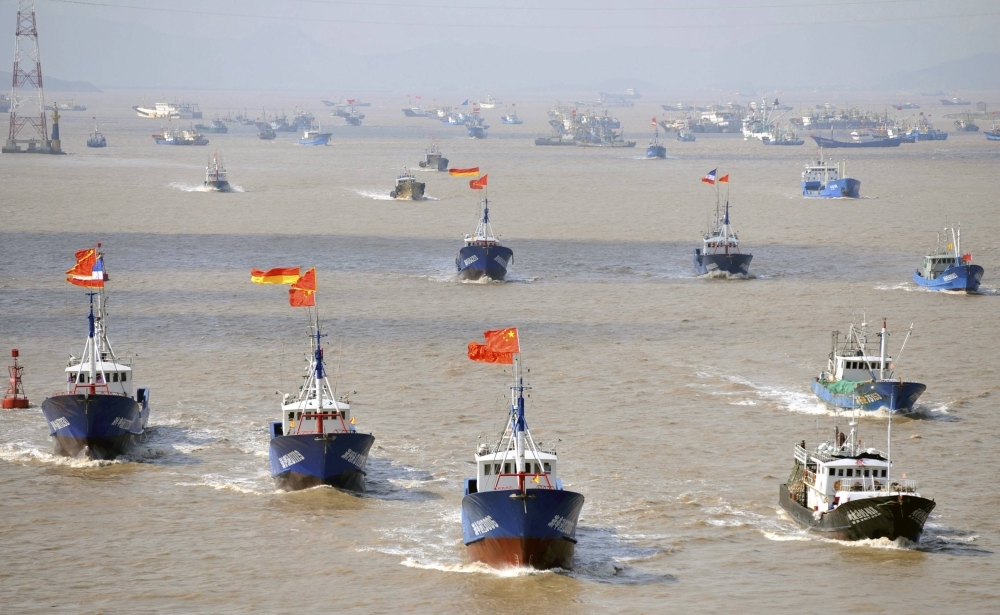 Chinese fishing boats depart from a port in Zhejiang province on their way toward the East China Sea where the disputed Senkaku Islands are located. China uses swarming tactics around the islets involving multiple vessels in its effort to challenge Japan's control over the area.

 