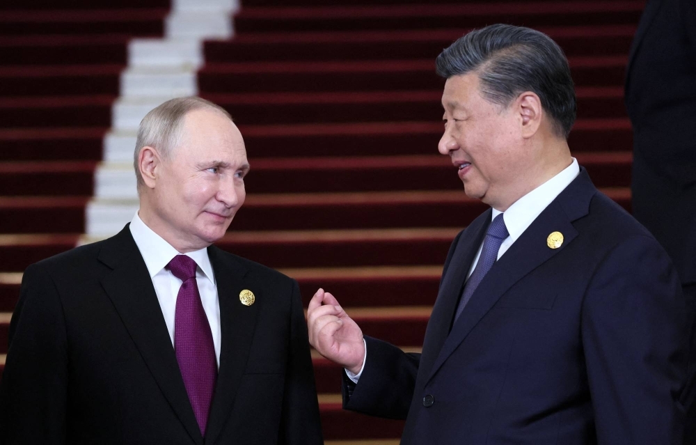 Russian President Vladimir Putin is welcomed by Chinese President Xi Jinping during a ceremony at the Belt and Road Forum in Beijing on Tuesday.