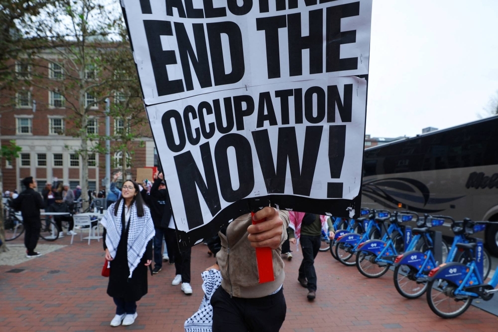 Demonstrators march against the ongoing conflict between Israel and the Palestinians outside Harvard University in Cambridge, Massachusetts, on Oct. 14.