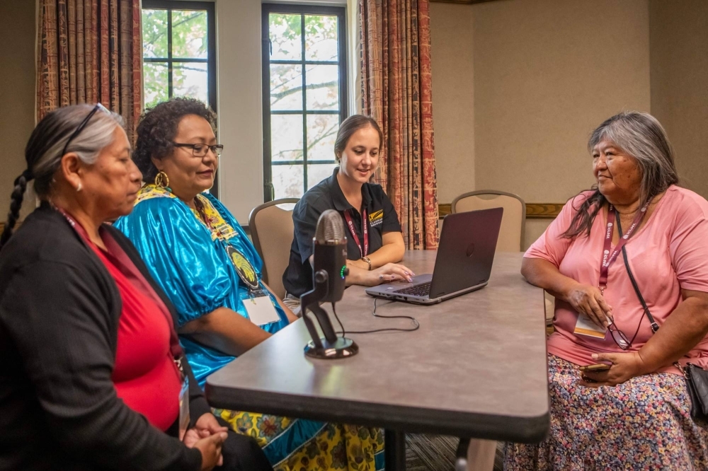 Ashleigh Surma (second from right) assists Elva Case (left), Linda Lupe (second from left) and Joycelene Johnson in recording indigenous languages during the ICILDER 2023 Conference in Bloomington, Indiana