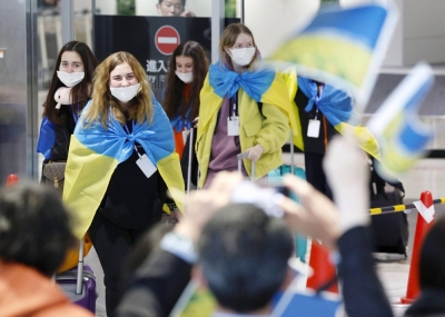People evacuated from Ukraine arrive at Fukuoka Airport in February.