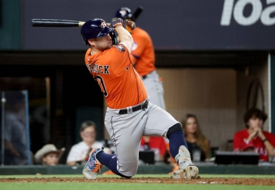 Astros center fielder Chas McCormick hits a two-run homer against the Rangers during the seventh inning in Game 4 of the ALCS in Arlington, Texas, on Thursday.