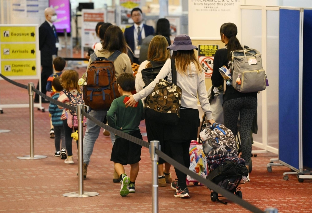 Japanese evacuees from Israel arrive at Tokyo's Haneda Airport via an Air Self-Defense Force aircraft early Saturday.
