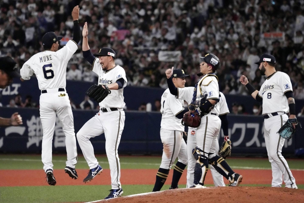 Orix Buffaloes players celebrate after the team clinched its third straight trip to the Japan Series on Saturday in Osaka. 