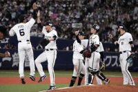 Orix Buffaloes players celebrate after the team clinched its third straight trip to the Japan Series on Saturday in Osaka.  | Kyodo 