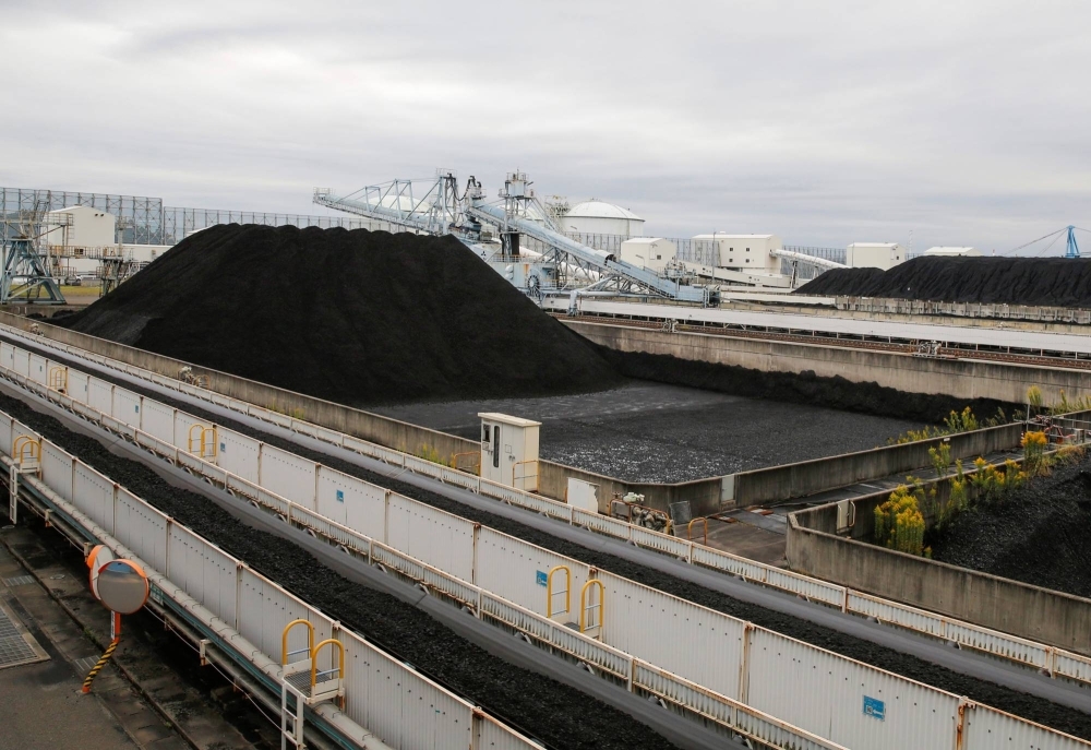 Piles of coal at JERA's Hekinan plant in 2021. Japan aims to lower coal’s share of its energy mix to 19% by 2030, despite calls from the United Nations and environmental organizations for OECD countries to stop all use of coal by then.