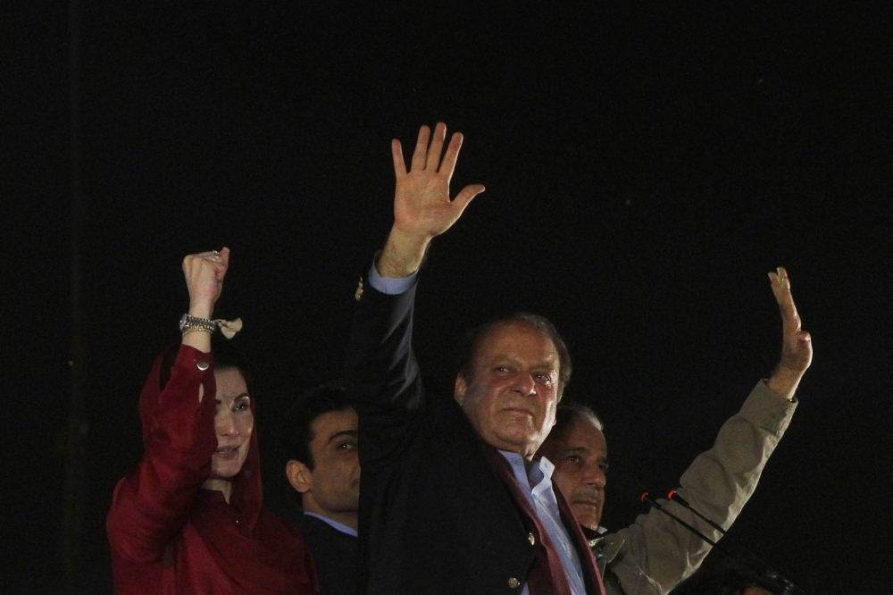 Former Pakistani Prime Minister Nawaz Sharif waves to supporters upon his return from a self-imposed exile in London, in Lahore on Saturday. 