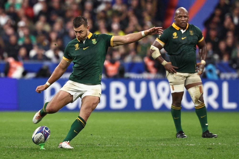 South Africa's Handre Pollard (left) converts an eventual match-winning penalty kick against England during their Rugby World Cup semifinal in Paris on Saturday.